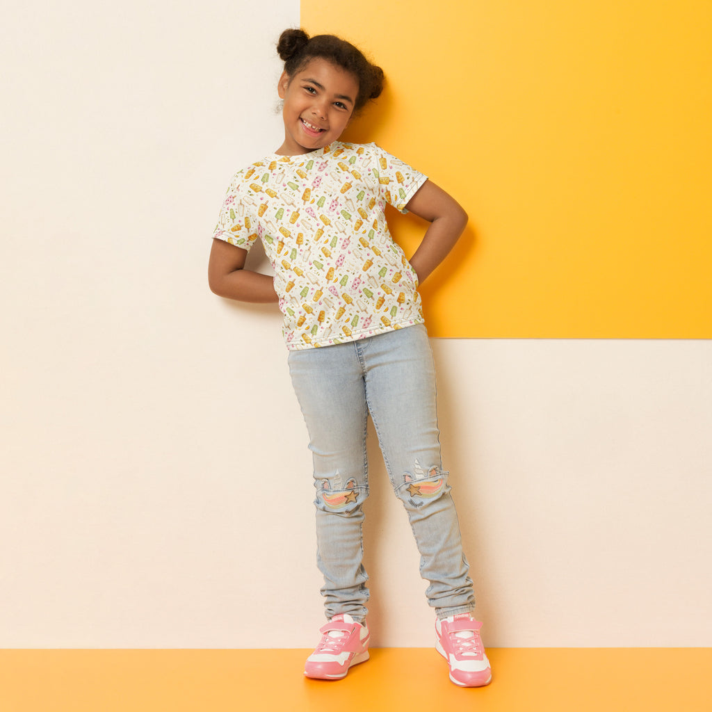 Model wearing kulfi print little kid tee